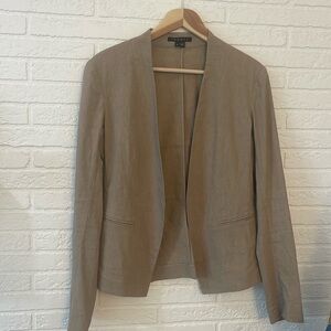Stylish Good used condition tan open front blazer.